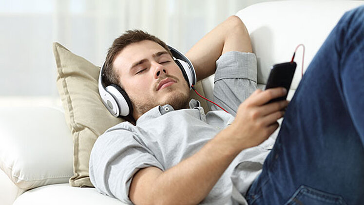 ORS offers competent solutions for radio streaming young man listening to music
