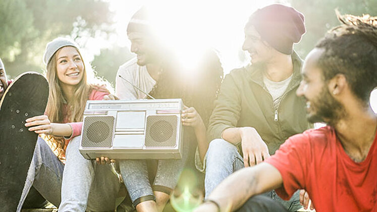 FM radio broadcasting from ORS young people listening to music