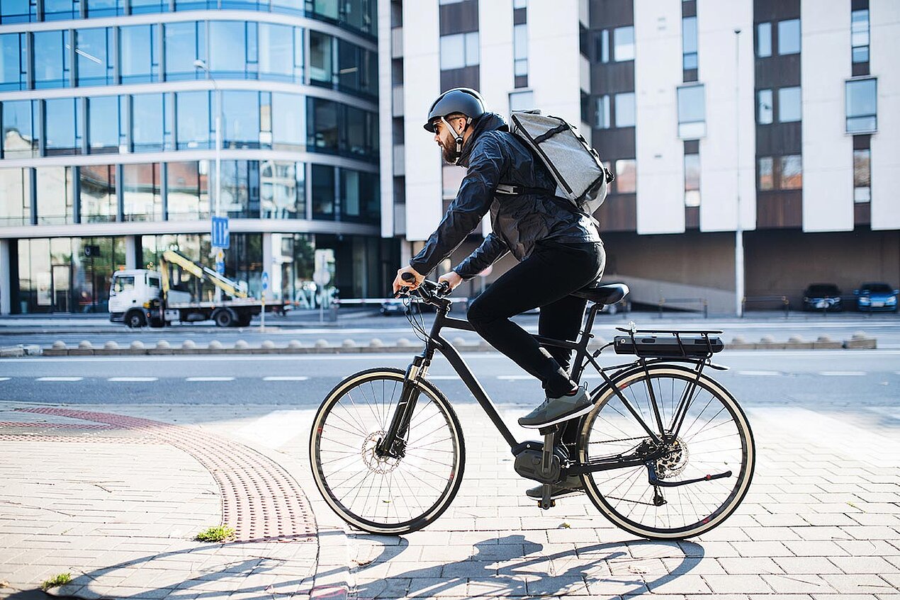 young man riding a bicycle